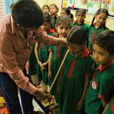 Winter season comes even to Bangladesh. Tailor takes measures for a warm uniforms.